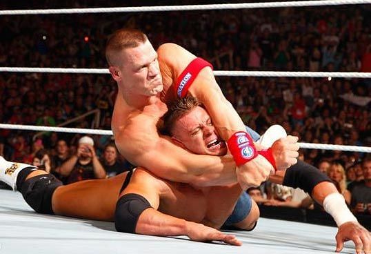John Cena in the ring with Alex Riley