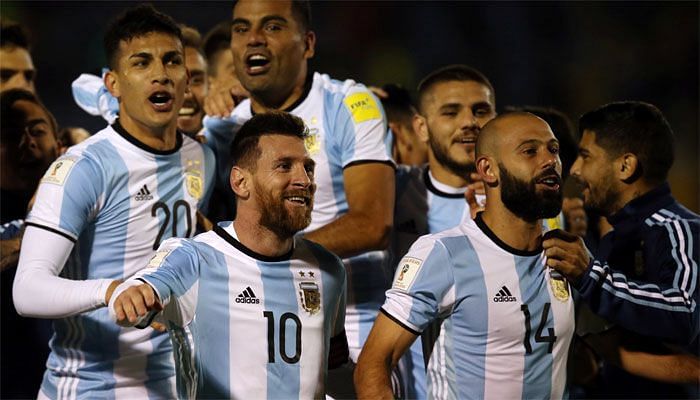 Messi celebrating with his teammates after scoring against Ecuador.