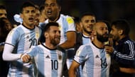Messi celebrating with his teammates after scoring against Ecuador.