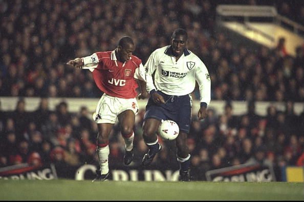 Ian Wright of Arsenal (left) tangles with Sol Campbell of Tottenham
