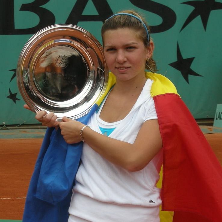 Halep with the French Open Junior Championship trophy in 2008