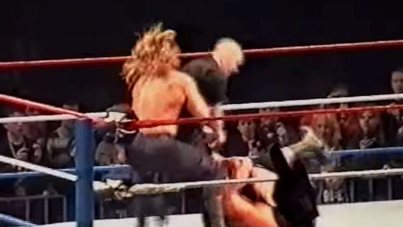 Triple H suplexing a ring intruder