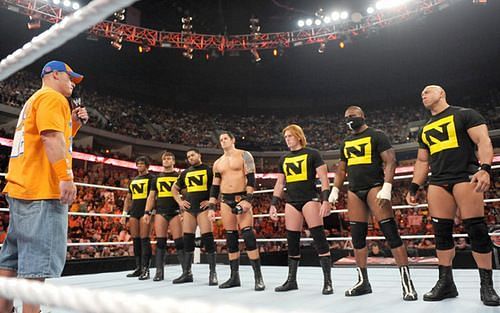 John Cena in the ring with Nexus