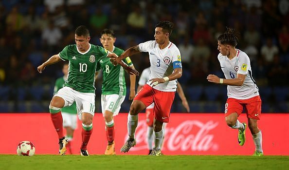 Roberto De La Rosa of Mexico and Lucas Alarcon of Chile in action during the FIFA U-17 World Cup India 2017 group E match between Mexico and Chile at Indira Gandhi Athletic Stadium on October 14, 2017 in Guwahati, India.