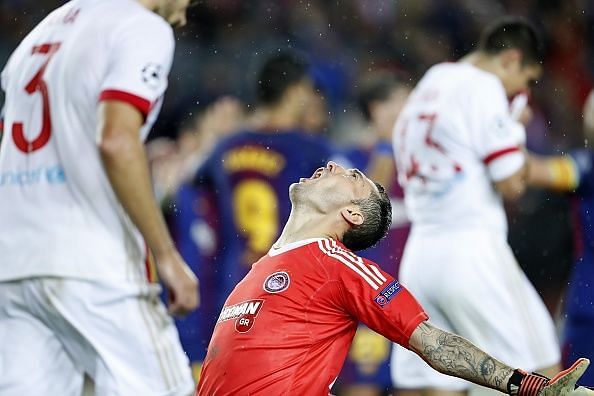 Proto reacts after the Olympiacos defence failed to contain the 10 men of Barcelona