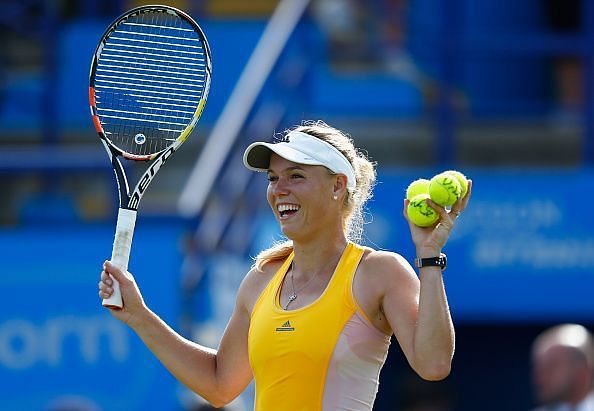 Wozniacki wobbles on way to China Open round two