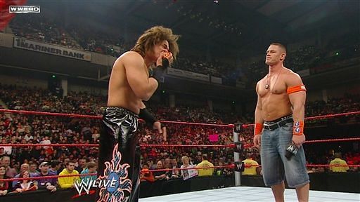 John Cena in the ring with Carlito