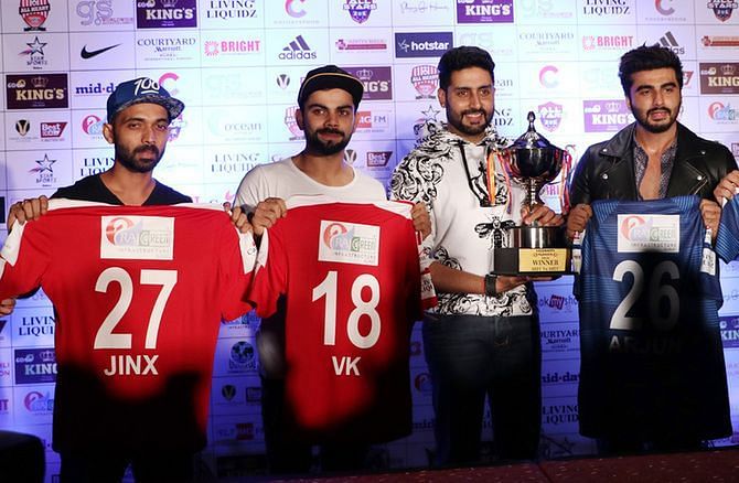 The captains of both the teams unveil the jerseys and the trophy before the 2016 charity match