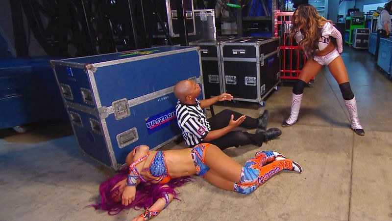 Sasha Banks on the floor after being attacked by Alicia Fox