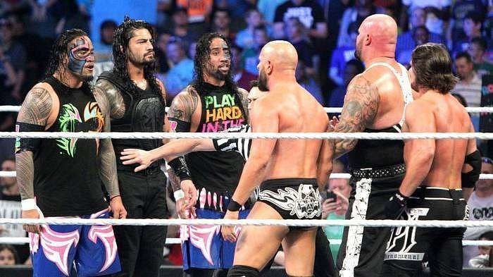Roman Reigns and The Usos facing off against The Club