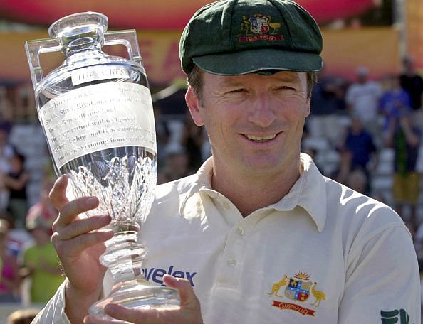 Steve Waugh holds aloft a replica of the Ashes urn