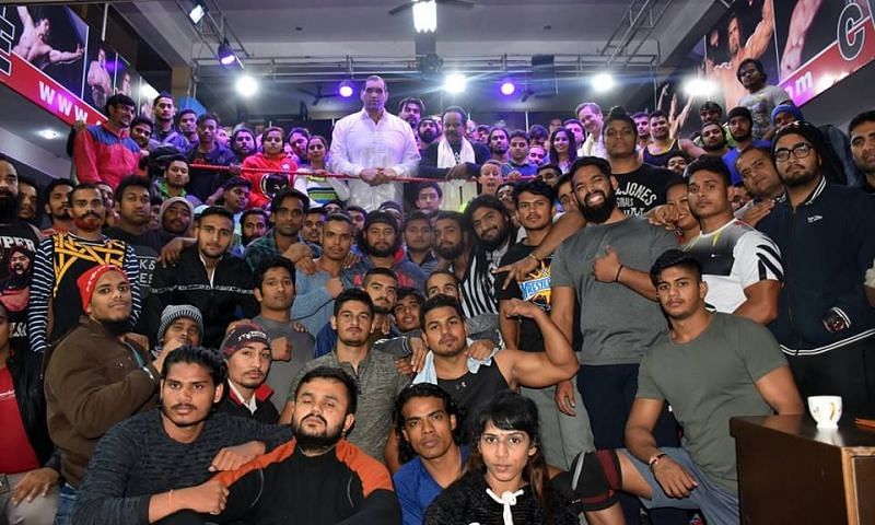 The Great Khali with budding Superstars and WWE officials at his wrestling school