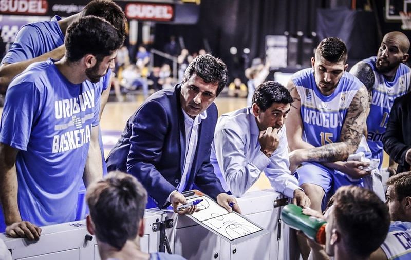 Uruguay head coach Marcelo Americo Signorelli draws up a play against Paraguay.