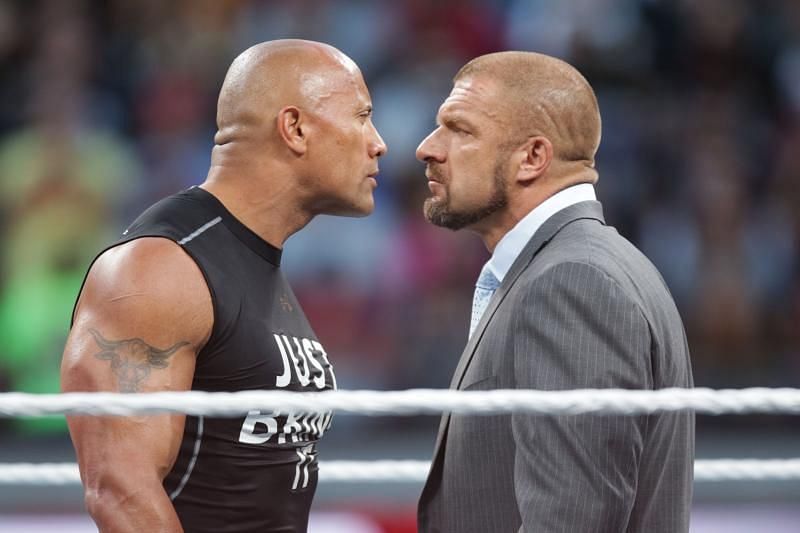 IMAGE DISTRIBUTED FOR WWE - Dwayne the Rock Johnson stares off against WWE superstar Triple H at WrestleMania 31 on Sunday, March 29, 2015 in Santa Clara, CA. WrestleMania broke the Levi&acirc;€™s Stadium attendance record at 76,976 fans from all 50 states and 40 countries. (Don Feria/AP Images for WWE)