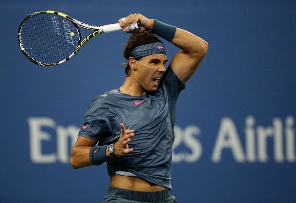 Rafael Nadal is famous for his his reverse finish. His arm ends up very high and goes behind his head which results in him increasing the upward angle which generates more top spin.