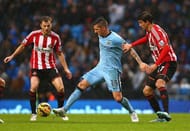 Manchester City's Stevan Jovetic tries to get past two defenders