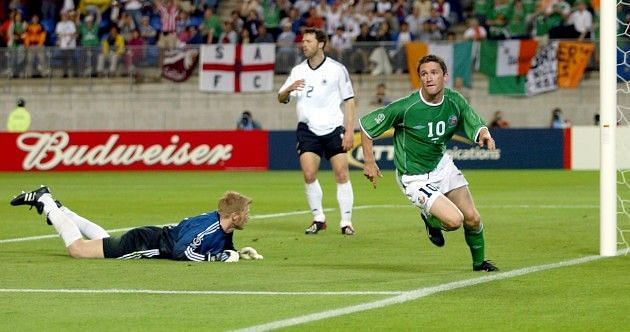Keane leaves Golden Ball winner, Oliver Kahn on the turf after his late equaliser against Germany. 