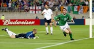 Keane leaves Golden Ball winner, Oliver Kahn on the turf after his late equaliser against Germany.