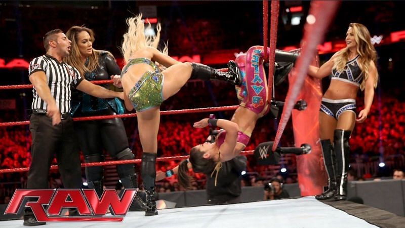 Emma in a tag-team match with Sasha, Nia Jax and Bayley