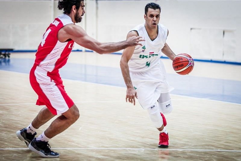 Iraq&#039;s Qutaiba Al-doori (4) sprints down the court against his Iranian counterpart.