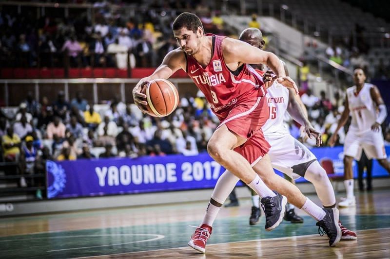 Mohamed Hadidane (9) drives down the lane against Cameroon en route to a 3-0 start.