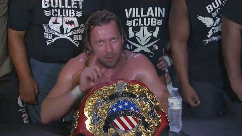 Kenny Omega with his title
