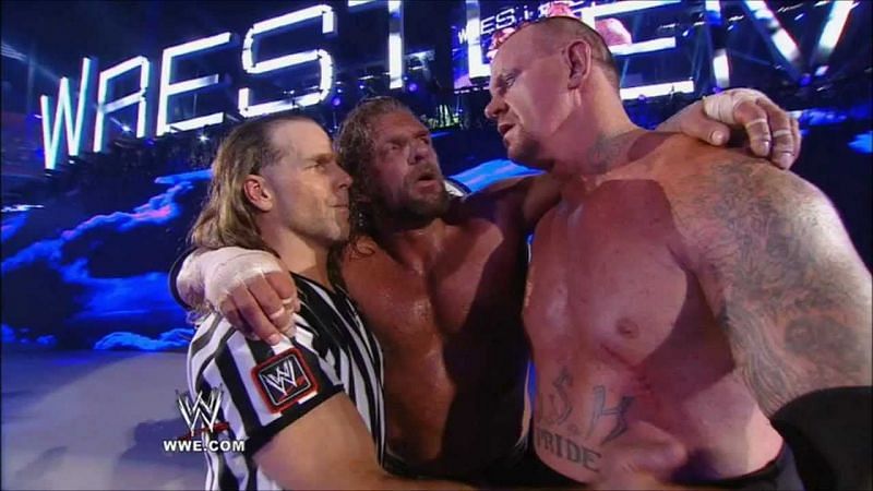 Taker with Michaels and Hunter at Wrestlemania 28
