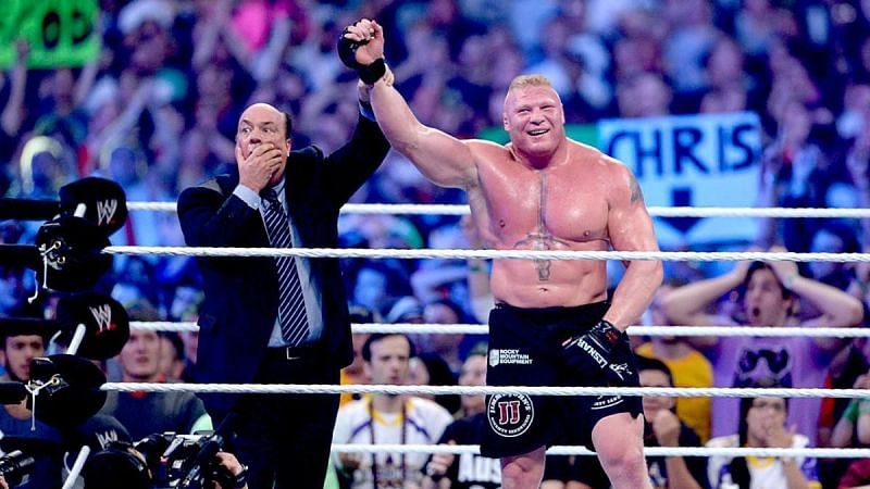 A shocked Paul Heyman lifting his client&#039;s arm at WrestleMania XXX