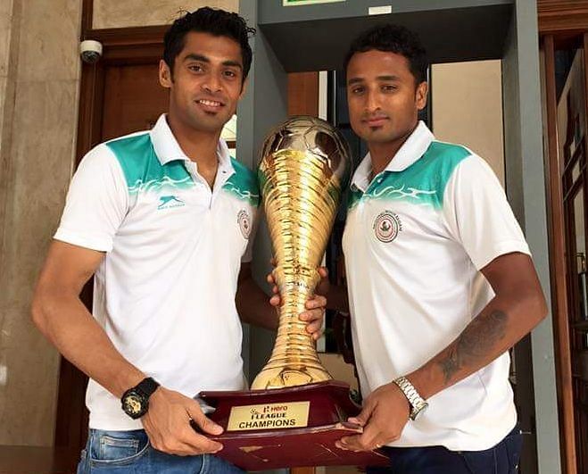 Kingshuk Debnath (R) posing with the I-League trophy alongside Shilton Paul