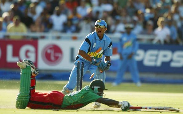 Indian wicketkeeper Rahul Dravid appeals to the Umpire for a run out while Maurice Odumbe of Kenya reaches for the crease