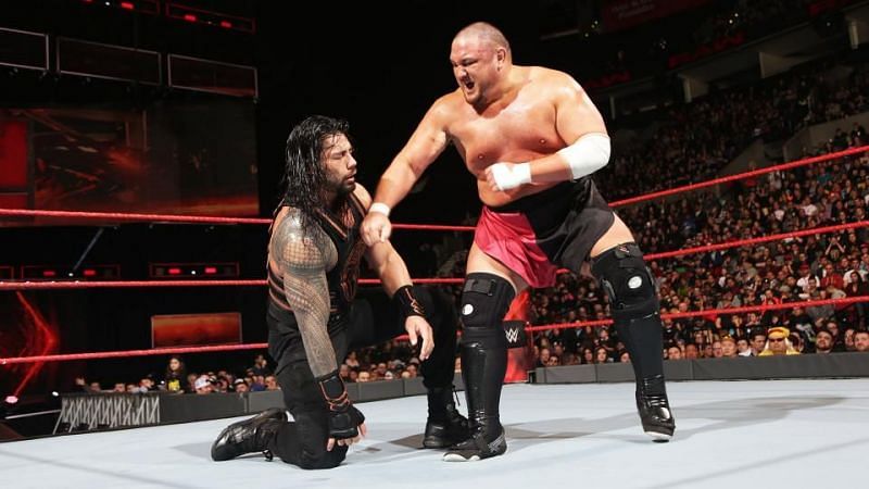 Samoa Joe in the ring with Roman Reigns