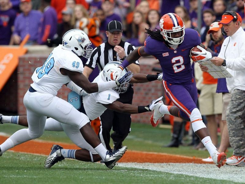 Kelly Bryant (2) shakes off 2 Citadel defenders en route to a 61-3 victory.