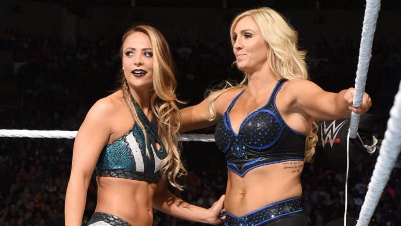 Emma in the ring with Charlotte Flair