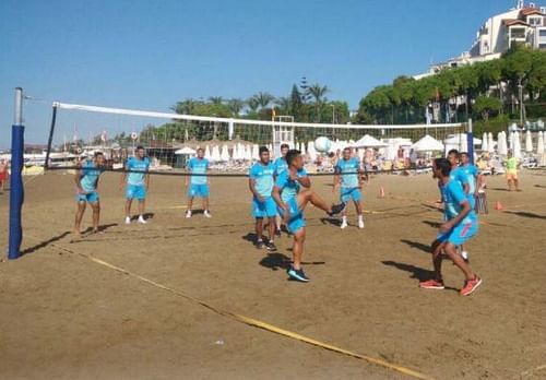 North East United FC players cool off during their pre-season tour, by playing sepak takraw.