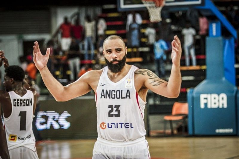 Angola&#039;s Reggie Moore (23) pumps up the crown during their game against Morocco.