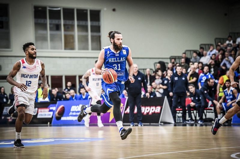 Greece&#039;s Charis Giannopoulos (31) runs it down the court for a basket against Great Britain.