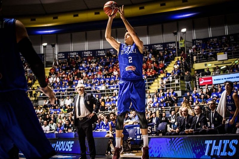 Italy&#039;s Simone Fontecchio (2) goes for a three point shot against the Romanians.