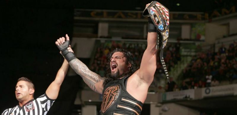 Roman Reigns poses with the IC Championship