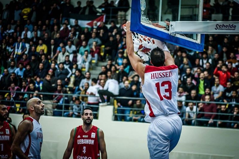 Mohammad Hussein (13) dunks the ball for the 2-0 Jordanians.
