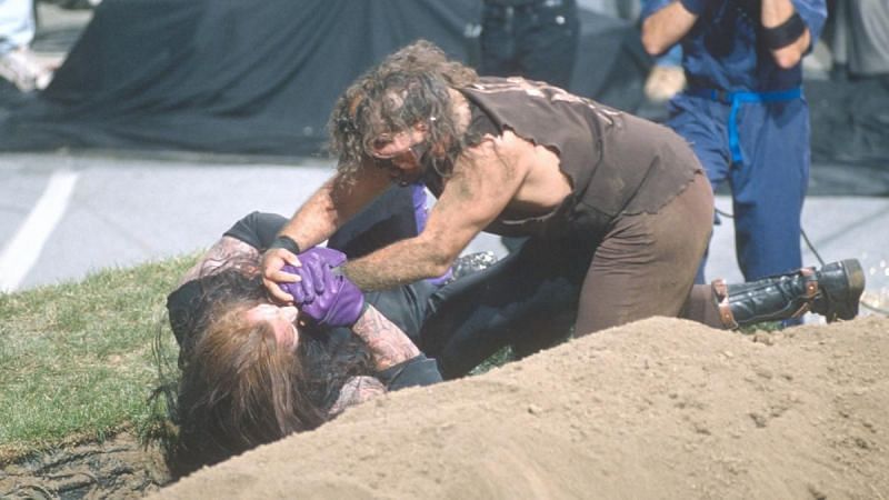 Mankind attempts to weaken The Undertaker with the Mandible Claw
