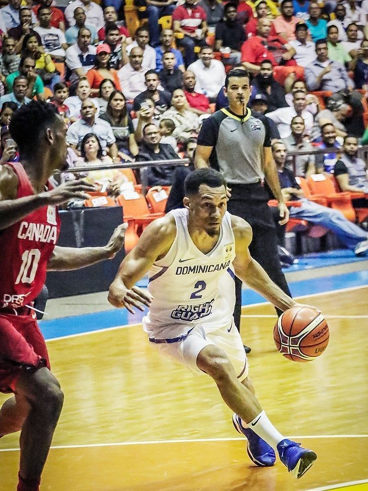 Dominican Republic&#039;s Rigoberto Mendoza drives to the hoop during their win against Canada.