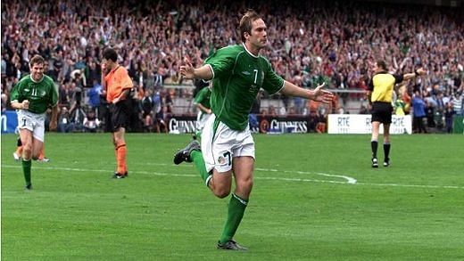 McAteer wheels off to celebrate his goal with the Lansdowne Road faithful. 