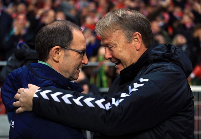 The two managers embrace before the game