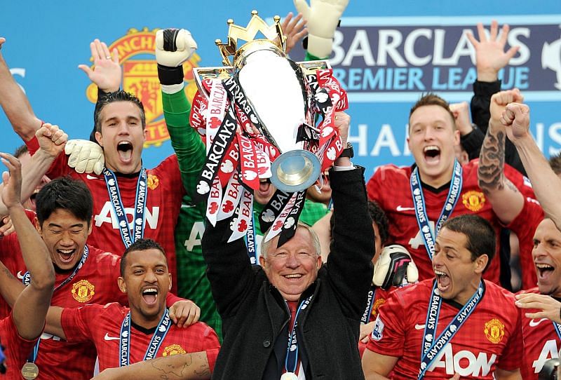 Manchester United players and then manager Sir Alex Ferguson celebrate the Premier League title won in 2013