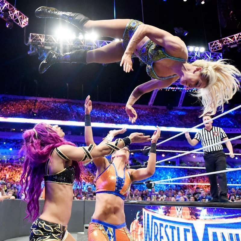 Charlotte executes a ring-to-outside moonsault.