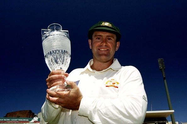 Mark Taylor holds aloft the Ashes trophy