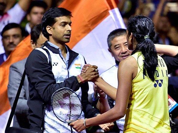 Sindhu is congratulated by coach Gopichand on her silver medal win at the 2016 Rio Olympics