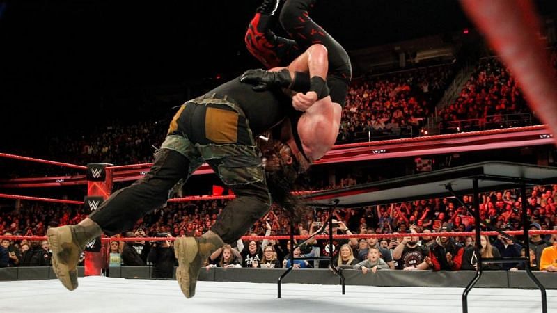 Braun Strowman laying waste to Kane after the match ended 