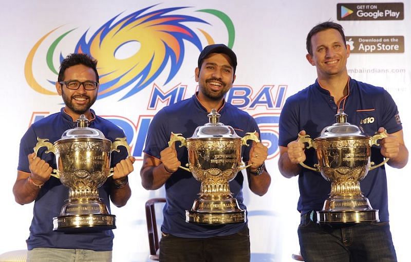 Parthiv Patel, Rohit Sharma and Shane Bond with the three IPL trophies