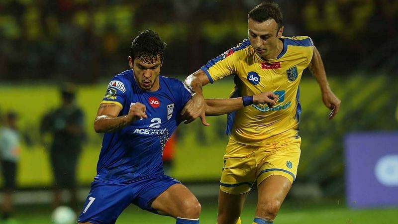 Berbatov (R) vies for the ball against Mumbai City FC